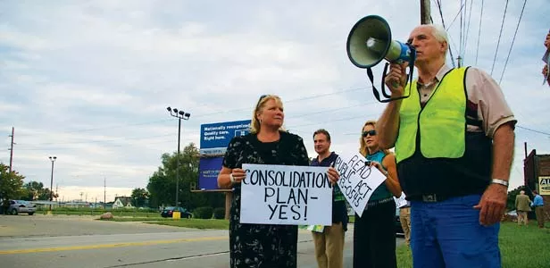 Steve Combs, president of Enos Park Neighborhood Improvement Association, leads opponents of the Third Street corridor Aug. 19 at the first of several planned raillies. - PHOTO BY R.L. NAVE