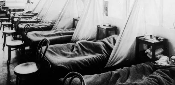 Influenza patients lie on cots at the U.S. Army Camp Hospital #45, Aix-les-Bains, France during the 1918 Spanish influenza outbreak. - PHOTO BY NATIONAL LIBRARY OF MEDICINE