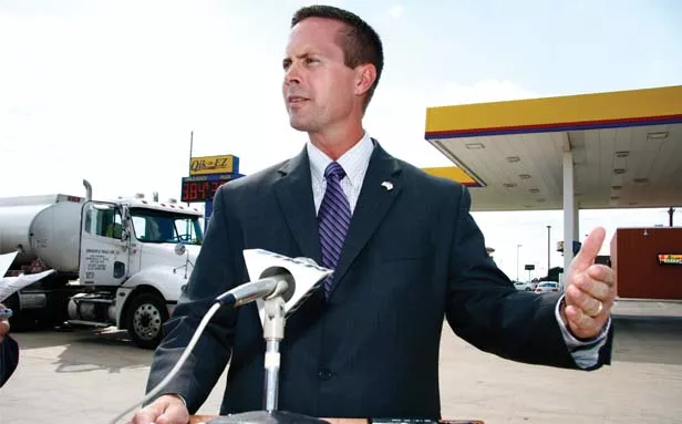 Republican Rodney Davis speaks to reporters about his “all of the above” energy policy at a gas station on the west side of Springfield. Illinois Action Now later protested one of Davis’ fundraiser events, saying that