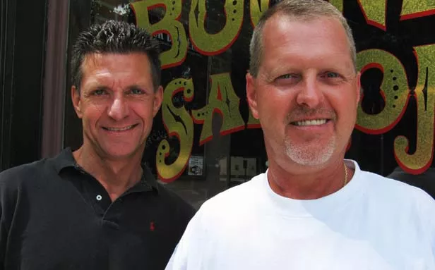 Steven Luparell, owner of Boone’s Saloon, and Charlie Roberts plan for the motorcycle benefit to become an annual event. - PHOTO BY GRACE SWEATT