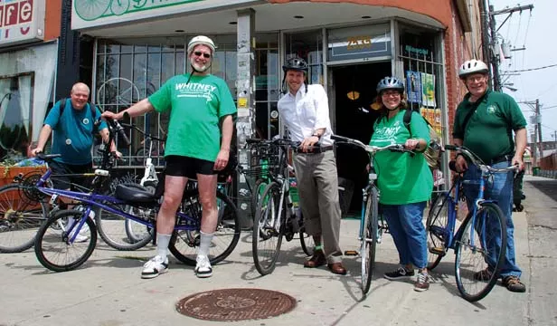 Whitney and supporters prepare to leave Chicago on Whitney’s 650-mile bike and train tour of the state.