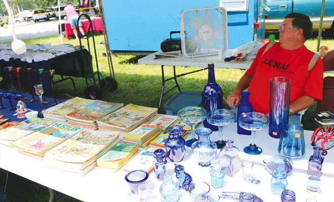 Offering glassware, shot glasses, salt-and-pepper shakers and vintage copies of Hustler, vendor Art Mattingly caters to redneck lust for the finer things in life. - PHOTO BY BRUCE RUSHTON