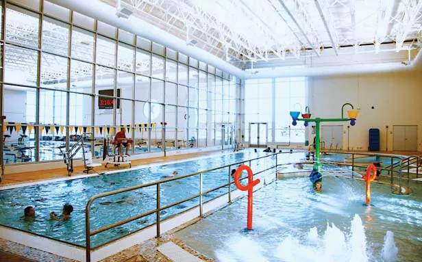 The Gus and Flora Kerasotes Branch of the YMCA that opened last fall features an aquatic play area for kids, right, a warm-water pool for rehabilitation, center, and a lap pool, left, for folks to swim their hearts out. - PHOTO BY PATRICK YEAGLE