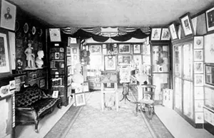 Osborn Oldroyd sold this souvenir photo of his Lincoln museum, located on the first floor of the Lincoln Home, for twenty-five cents. Descriptions of the numbered artifacts were printed on the back of the photo. - PHOTO COURTESY OF THE LINCOLN HOME NATIONAL HISTORIC SITE