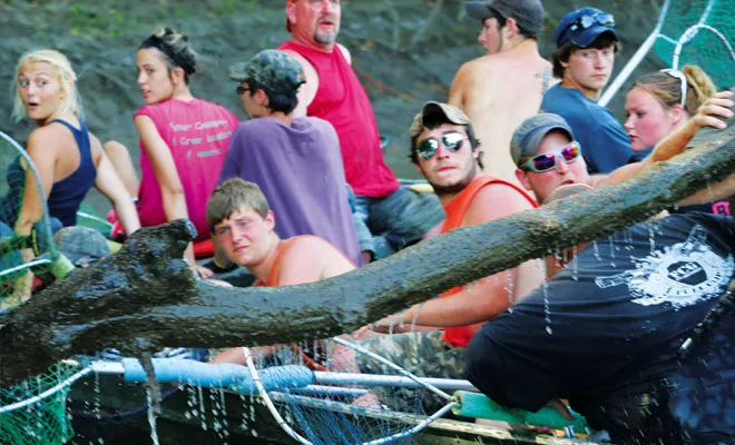 With hazards ranging from logs to boats that come too close, fishing the redneck way is a full-contact sport. - PHOTO BY BRUCE RUSHTON