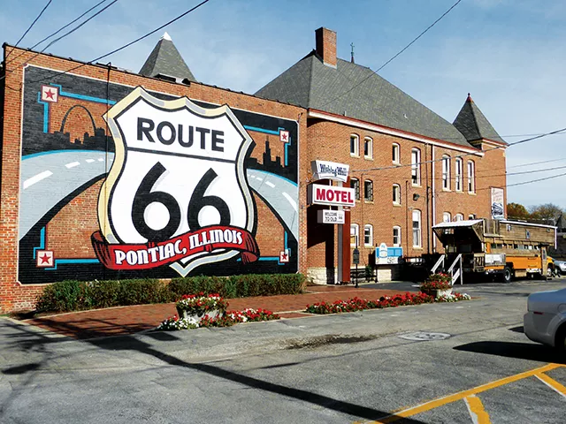 A mural highlighting Pontiac’s connection to Route 66 graces the back of the museum complex in this central Illinois town. The school bus/home of Springfield-area resident and Route 66 aficionado Bob Waldmire sits in the parking lot. - MARY BOHLEN