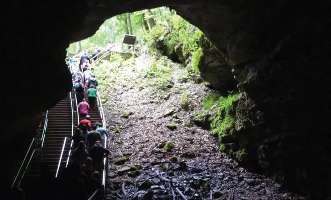 Visitors exiting Mammoth Cave in central Kentucky pass through the Historic Entrance, where Native Americans and pioneers originally entered the cave. - PHOTO BY BRENT BOHLEN