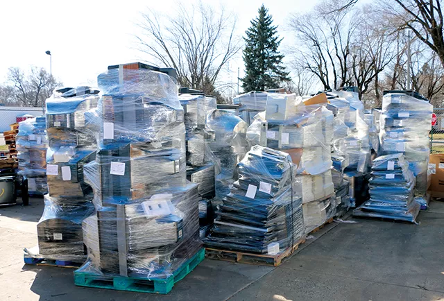 Mountains of processed TVs outisde behind BLH waiting to be shipped to Ohio. - PHOTO BY BRANDON TURLEY