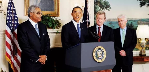President Barack Obama speaks on lower drug costs for seniors. Looking on are: AARP CEO Barry Rand, Senator Max Baucus, D-MT, and Senator Chris Dodd, D-CT. - PHOTO BY OLIVIER DOULIERY