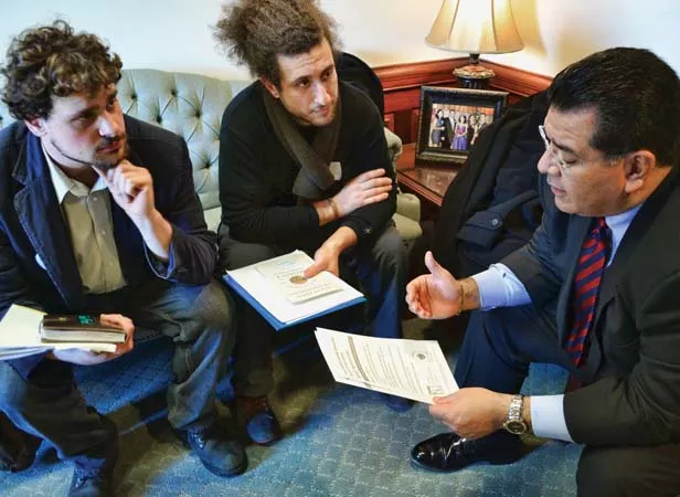 Craig Sadur (left) and Alex Poltorak (center), farmers from Urban Canopy, a rooftop farm in Chicago, discuss composting reform with Sen. Martin Sandoval, D-Cicero. - PHOTO BY JACQUELINE MUHAMMAD