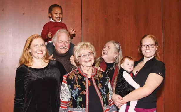JoAnn’e Glatfelter surrounded by her family at her 80th birthday party: to the left, granddaughter Anne Schaeffer, son-in-law Peter Glatz who is carrying his grandson, Robbie on his shoulders. On the right, daughter Julianne Glatz, a - PHOTO BY HARV KOPLO