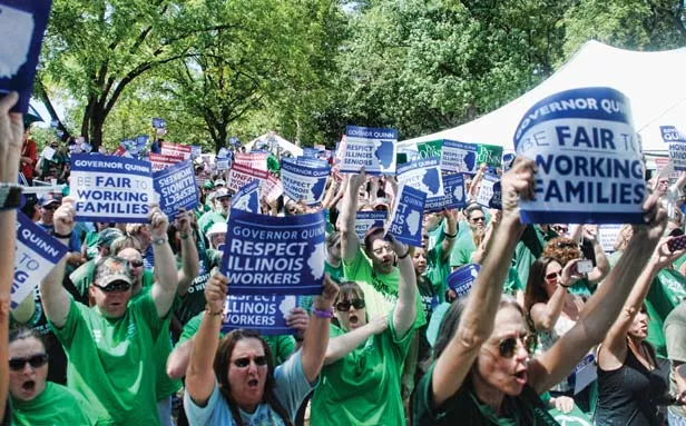 AFSCME members boo Gov. Pat Quinn’s speech at the Illinois State Fair in protest of his proposals to cut salaries, raises and entire state facilities. - PHOTO COURTESY OF AFSCME