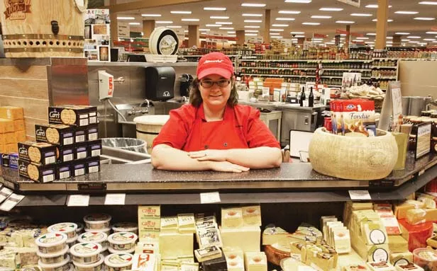 Monvale Schnucks specialty cheese counter manager Leah Reel knows cheese and Schnucks stores offer more than 200 kinds. - PHOTO BY DAVID HINE