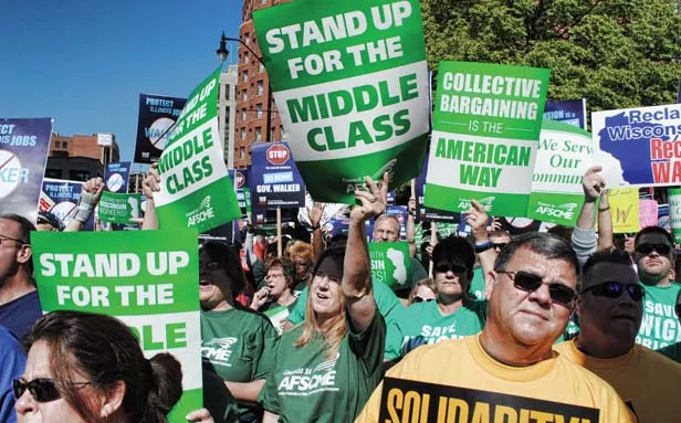 AFSCME Council 31 members protest outside the President Abraham Lincoln Hotel in downtown Springfield during the visit of Wisconsin Gov. Scott Walker, whom the Illinois Chamber of Commerce invited to speak in April about this state’s business - PHOTO COURTESY OF AFSCME