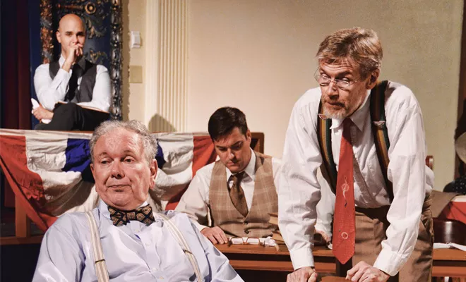 Other cast members look on as Henry Drummond (Jim Dahlquist, right) questions Matthew Brady (Rich McCoy, left) - PHOTO BY DONNA LOUNSBERRY