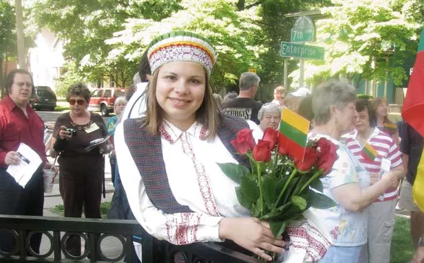 Kourtney Baker, a fourth-generation Lithuanian-American and student at Sacred Heart-Griffin High School, donned traditional dress for the historical marker unveiling. She plans to visit Lithuania with her mother after graduation. - PHOTO BY WILLIAM FURRY