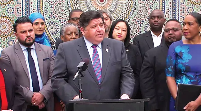 Gov. J.B. Pritzker stands with lawmakers and advocates during a signing event June 20 in Chicago for an executive order aimed at increasing participation in the 2020 U.S. Census. - PHOTO BY BLUEROOMSTREAM