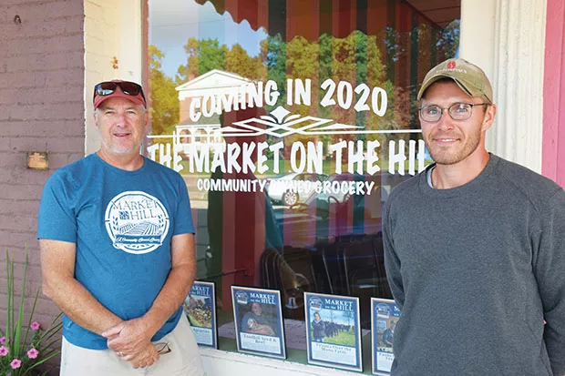Market on the Hill President Tom Martin, left, and Hilltop Community Garden Field Manager Kyl Reed in front of the grocery that will open in Mt. Pulaski in spring 2020. - PHOTOS BY DAVID BLANCHETTE