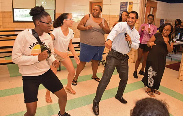 Julio Barrenzuela dances with Springfield Urban League Summer Camp participants at Washington Middle School. - PHOTOS BY DAVID BLANCHETTE