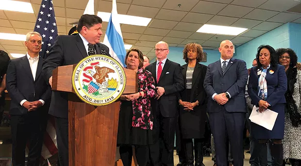 Gov. J.B. Pritzker speaks during a ceremony Jan. 17 in Chicago marking the signing of a bill requiring anyone who holds a federal firearms license to also obtain a state “certificate of license” and comply with state regulations. That law is b - PHOTO @GOVPRITZKER ON TWITTER