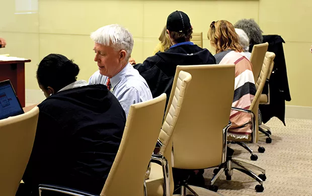 Land of Lincoln Legal Aid volunteer attorneys help summit participants with their expungement and sealing files and paperwork. - PHOTO BY DAVID BLANCHETTE