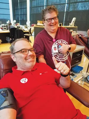 Collections specialist Robin Fuller assists blood donor Dave Levora during a blood drive held the day after Thanksgiving. - PHOTO COUTESTY MISSISSIPPI VALLEY REGIONAL BLOOD CENTER.