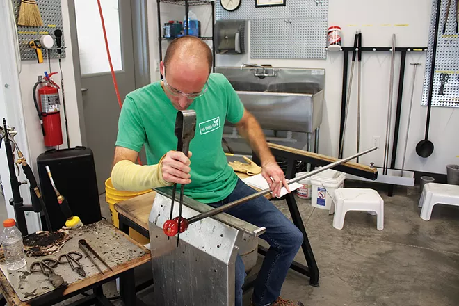Dathan Powell recently took his first class in glass-blowing and plans to continue with more advanced courses. - PHOTO BY JANET SEITZ