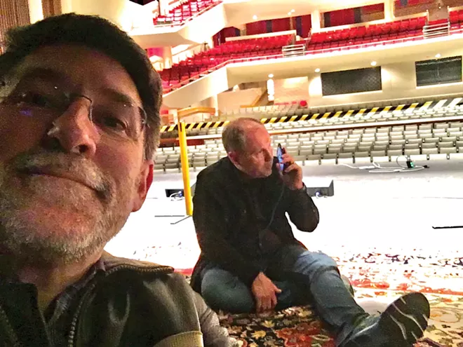 UIS Performing Arts Center Director Bryan Rives and event promoter Don Kronberg sit in an empty Sangamon Auditorium the night Ron White was scheduled to perform.
