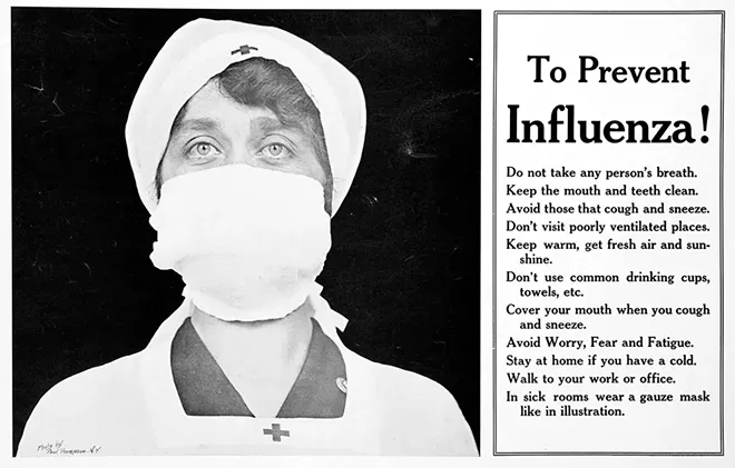A Red Cross nurse with a gauze mask. - PHOTO BY PAUL THOMPSON / PHOTO COURTESY SANGAMON VALLEY COLLECTION