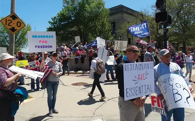 People rally in front of the Capitol in Springfield demanding Gov. JB Pritzker "reopen" Illinois for business amid the COVID-19 pandemic. - PHOTO BY PETER HANCOCK