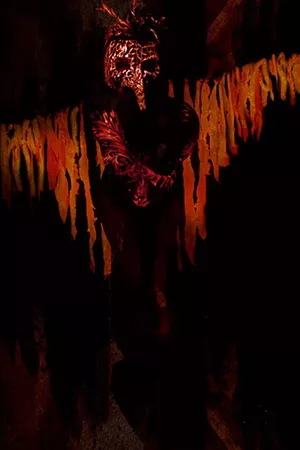 Claudia Knight's work incorporates body art and eccentric backdrops, in this piece she depicts a phoenix. - CREDIT: CLAUDIA KNIGHT
