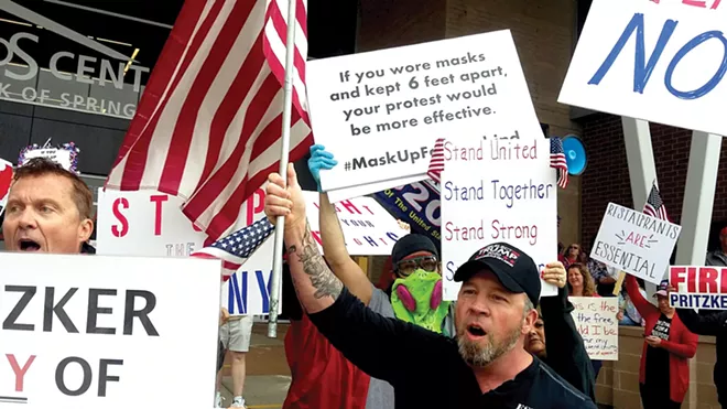 Protesters gathered outside the BOS Center in downtown Springfield while the legislature was in session, calling on lawmakers to roll back the governor’s stay-at-home restrictions. - PHOTO BY BRUCE RUSHTON.