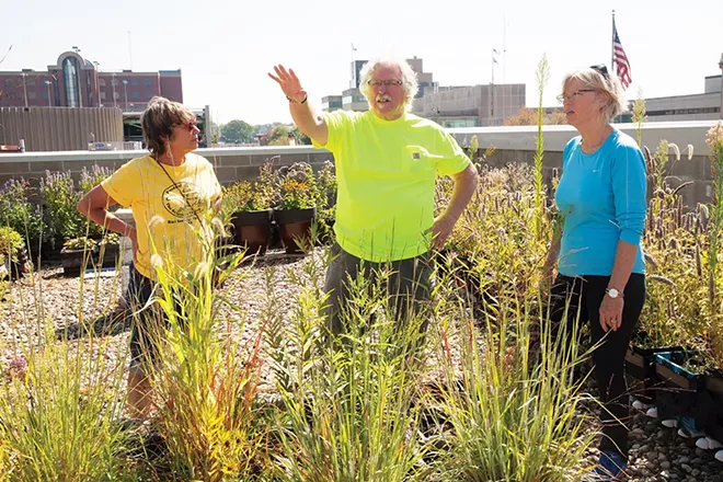 Michael Higgins, center, Grace Norris, left, and Susan Helm, right, on the rooftop garden above Maldaner’s.
