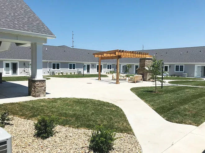 One of three beautiful outdoor spaces at Cedarhurst Senior Living, with landscaped courtyards, a fireplace and raised beds for gardening. - PHOTO COURTESY CEDARHURST OF SPRINGFIELD
