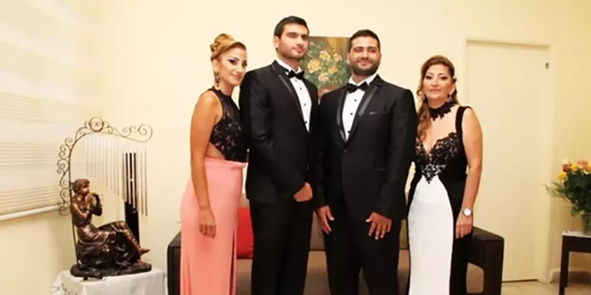 From left, siblings Nadine, Elie and Nabih Elhajj, with their mother, Zeina, in her living room in Beirut in 2015.
