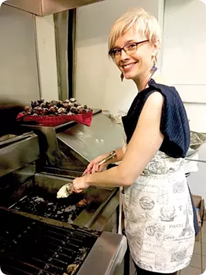 Dr. Leslie Smith prepares oliebollen, a traditional Dutch New Year’s treat, during a pop-up dinner at Vincent restaurant in Chicago.