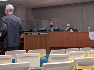 While Ward 9 Ald. Jim Donelan exhibits proper mask wearing, Ward 10 Ald. Ralph Hanauer lets his dangle during Wednesday's meeting at which the council approved fines for people who don't wear masks. - PHOTO BY BRUCE RUSHTON