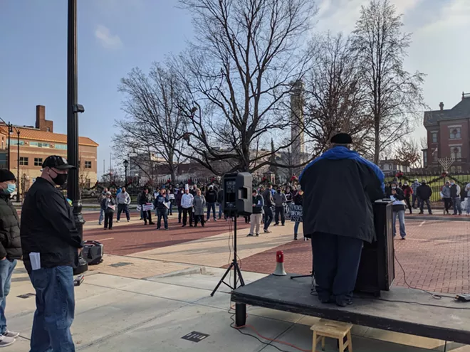 About 100 people gathered Saturday outside the governor's mansion to protest state orders shutting down bars and restaurants. - PHOTO BY BRUCE RUSHTON