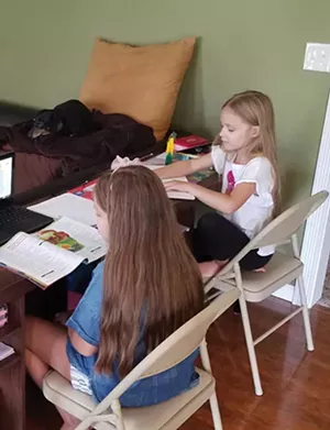 As students at Ball Charter, school board member Micah Miller's daughters continue to learn from home. - PHOTO COURTESY OF MICAH MILLE