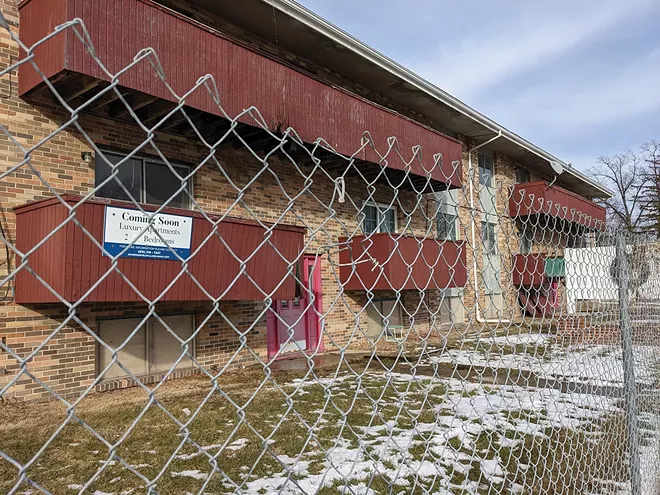 The owner of Bally Vaughn has posted a sign promising luxury apartments, “Coming soon.” - PHOTO BY BRUCE RUSHTON