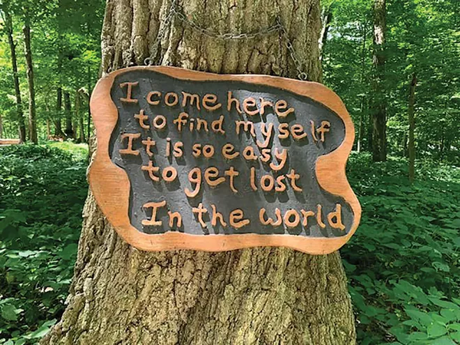 Some trees in the Chapel of the Templed Trees at Funk’s Grove have sayings to - inspire visitors to the serene spot.