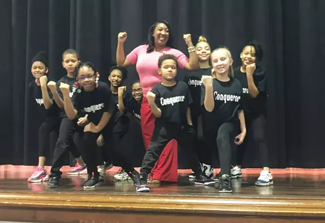 Erica Austin with a group of Feitshans Elementary School students who put on a play about Black inventors. - PHOTO COURTESY OF ERICA AUSTIN