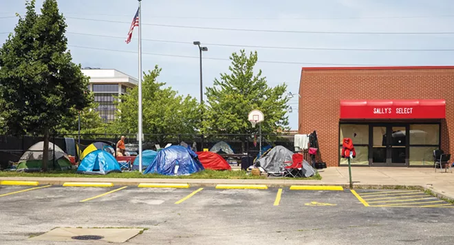 Marshawn Higgins, pictured right, is a resident of so-called tent city, a place where people seek shade, rest and shelter.