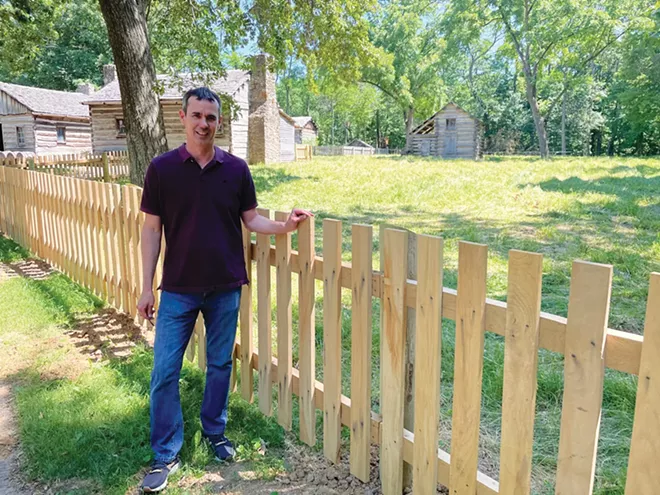 Lincoln's New Salem Historic Site Superintendent Jack Alexander with one of the site's new oak fences, which will corral a newly acquired pinto. - PHOTO BY WILLIAM FURRY