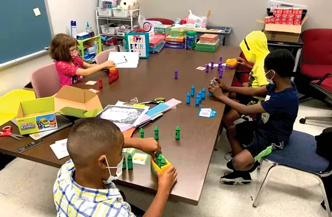 Second-graders at Camp Compass at Wilcox Elementary use letters to make words that match pictures. The summer programming has a focus on fun and play that leads to learning. - PHOTO BY LORI QUARTON, LITERACY COACH