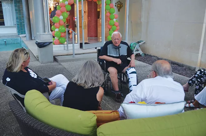 Former Gov. George Ryan talks with former staff and supporters during his recent Springfield book signing. - PHOTO BY DAVID BLANCHETTE