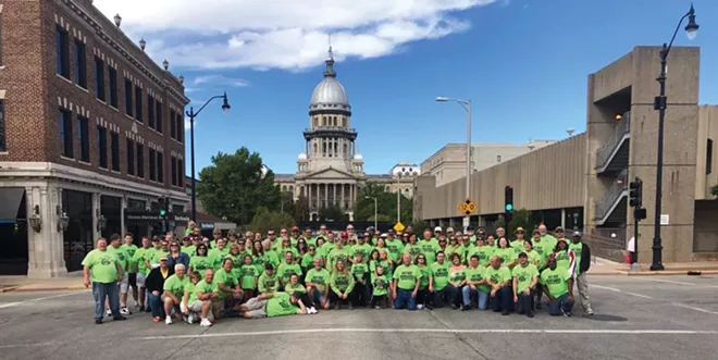 The Hot Rod Renegades car group pose near their preferred parking area on Capitol Street. - CREDIT: LOUIS JACKSON