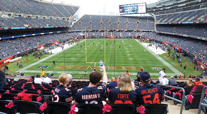 Fans settle into their seats prior to the start of a game between the Chicago Bears and the Detroit Lions at Soldier Field. - PHOTO BY CHRIS SWEDA