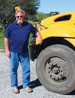 Bus driver Matt Ryan says despite sign-on bonuses and starting pay of $19 an hour, it's a struggle to find enough drivers to cover the routes every day. - PHOTO BY STACIE LEWIS.