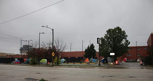 For months, representatives from the city and Salvation Army discussed how to make the building at 221 N. 11th St. fully operational. In the meantime, those without housing created a tent city at the site, lacking other options. As of Nov. 1, the building is now open as an overflow shelter for the winter months. - PHOTO BY STACIE LEWIS